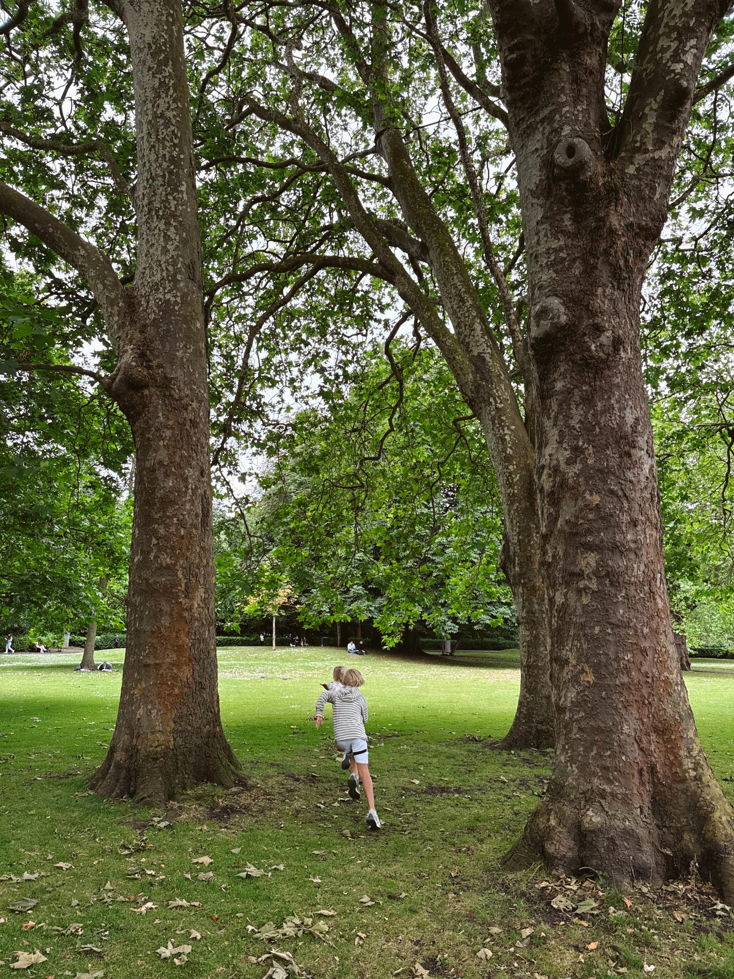 kids running in Saint Stephens green in dublin